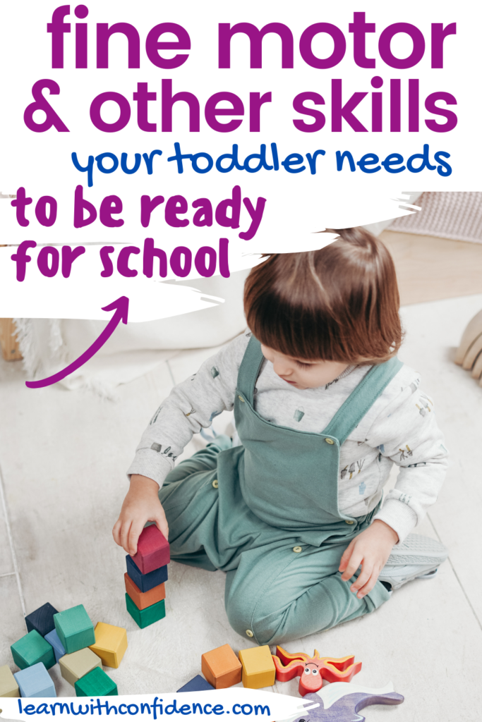 fine motor and other skills your toddler needs to be ready for school. small child playing with colorful building blocks.