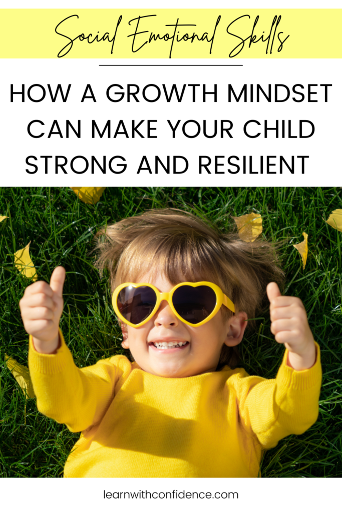 Social Emotional Skills. How a growth mindset man make your child strong and resilient. Child with yellow rimmed heart glasses and bright yellow top lying on his back holding two thumbs up and smiling. 