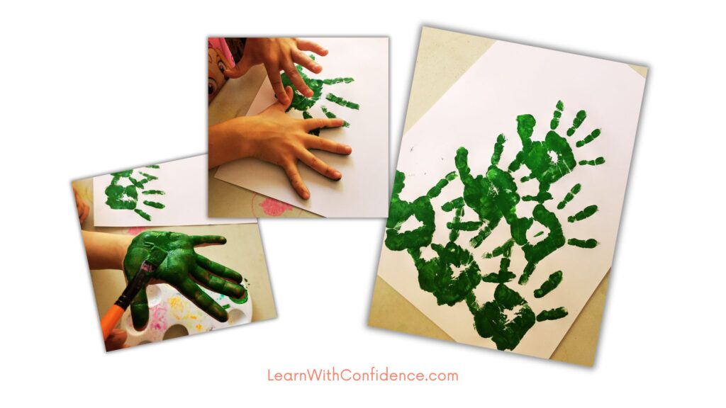 Step one  - Painted hand prints to create the Christmas tree.