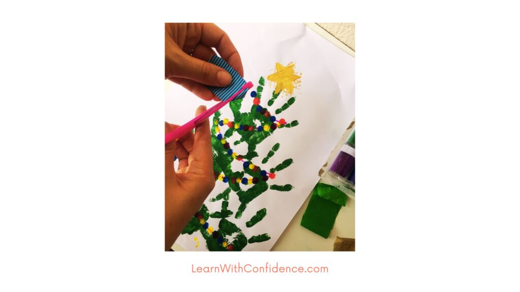 Step five - Practice scissor skills by cutting colorful paper to decorate the Christmas tree
